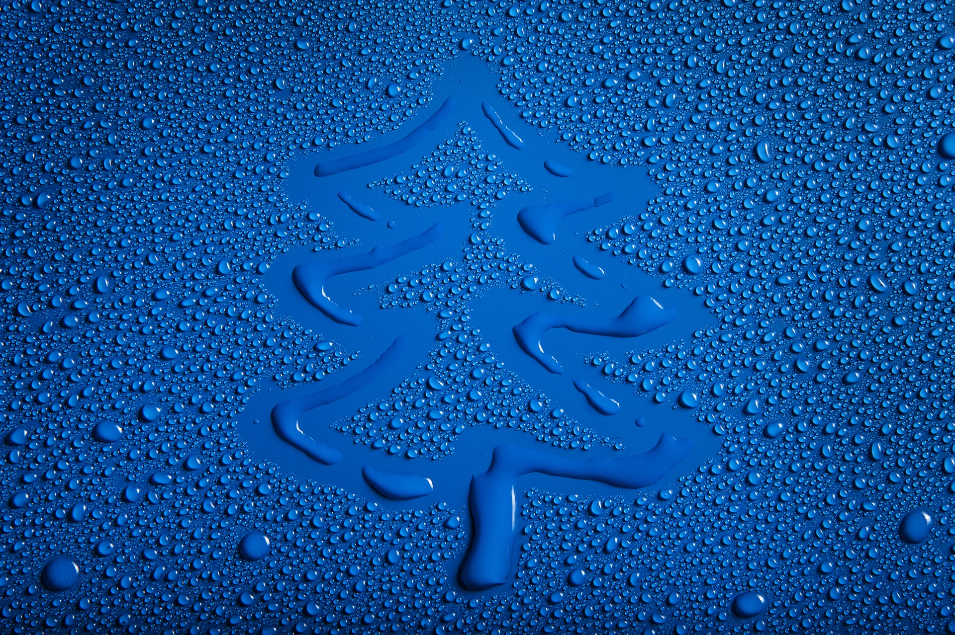 Blue water droplet on textured surface