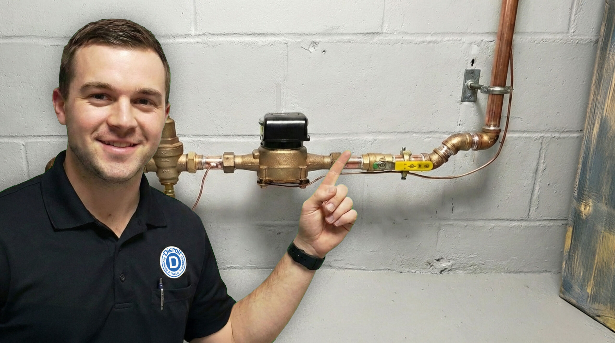Dierolf Technician pointing out the city municipal water line in a home