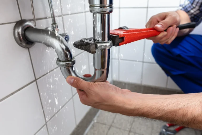Service technician fixing plumbing